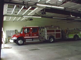 Fire Engine Parked Inside Pre-Engineered Metal Fire Station Buildings