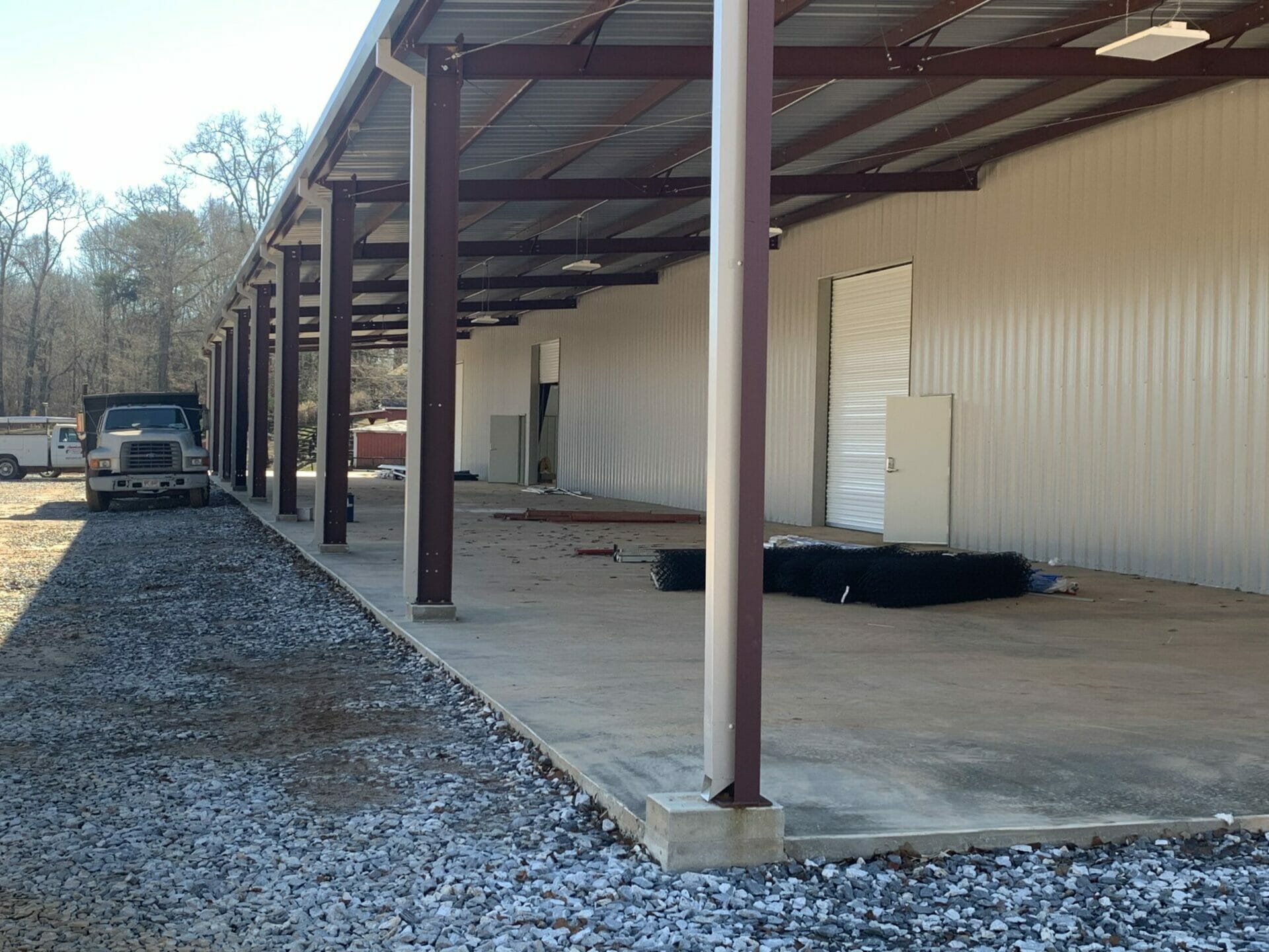 Pre Engineered Metal Building With Covered Outdoor Space, Lighting, And Roll Up Doors