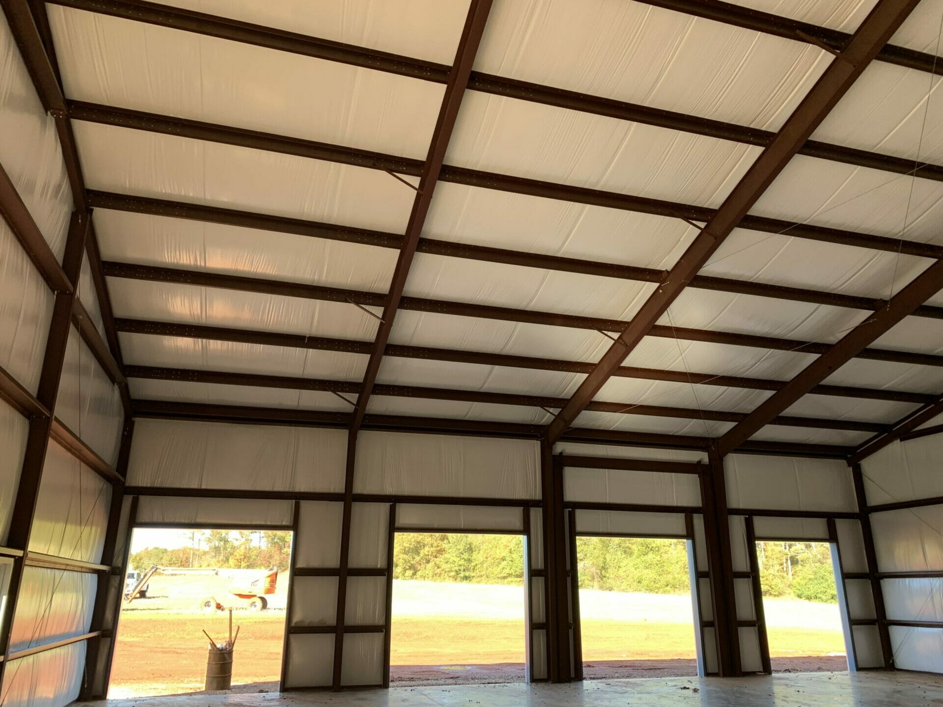 Interior View Of Pre-Engineered Metal Garage Building With Roll Up Garage Doors