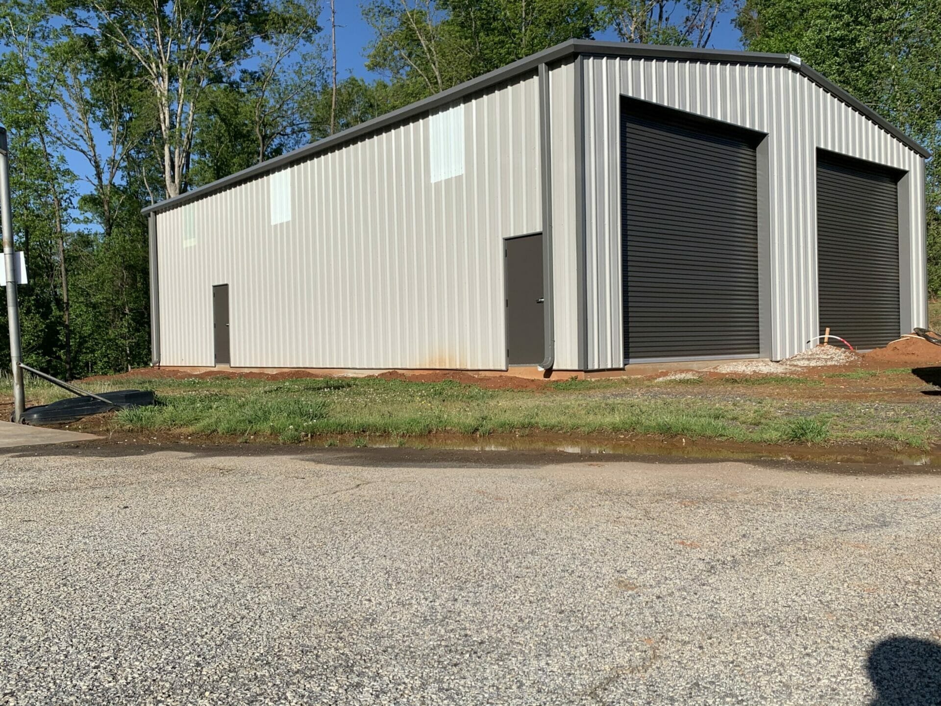 Pre-Engineered Metal Garage Building With Side Entry Doors And Roll Up Garage Doors