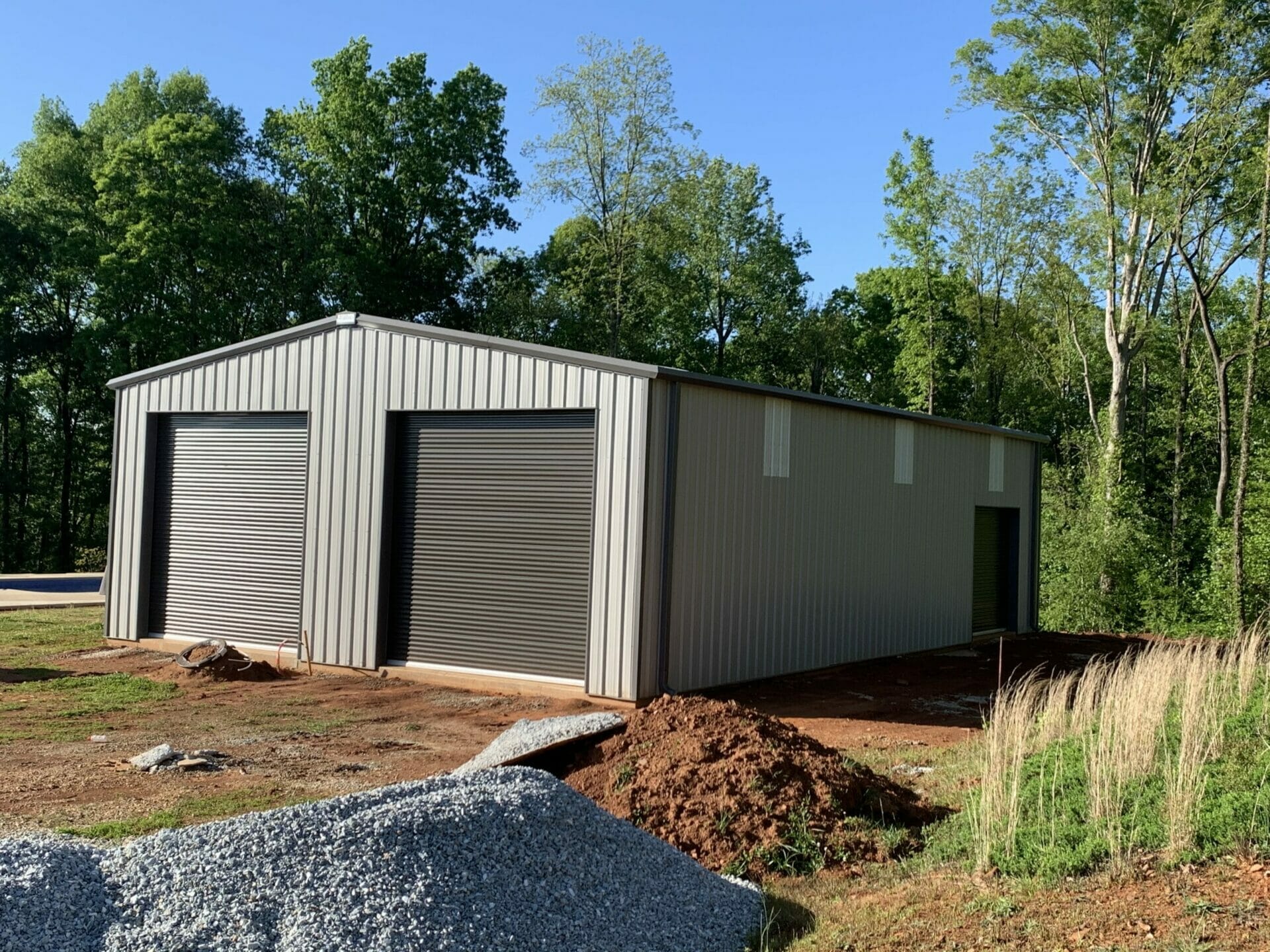 Custom Pre-Engineered Metal Multi-Bay Garage Building Custom Pre-Engineered Metal Multi-Bay Garage Building With Roll Up Garage Doors And Side Entry Door