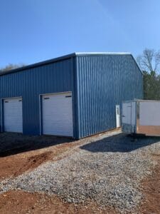 Custom Pre-Engineered Metal Multi-Bay Garage Building With Roll Up Garage Doors And Side Entry Door