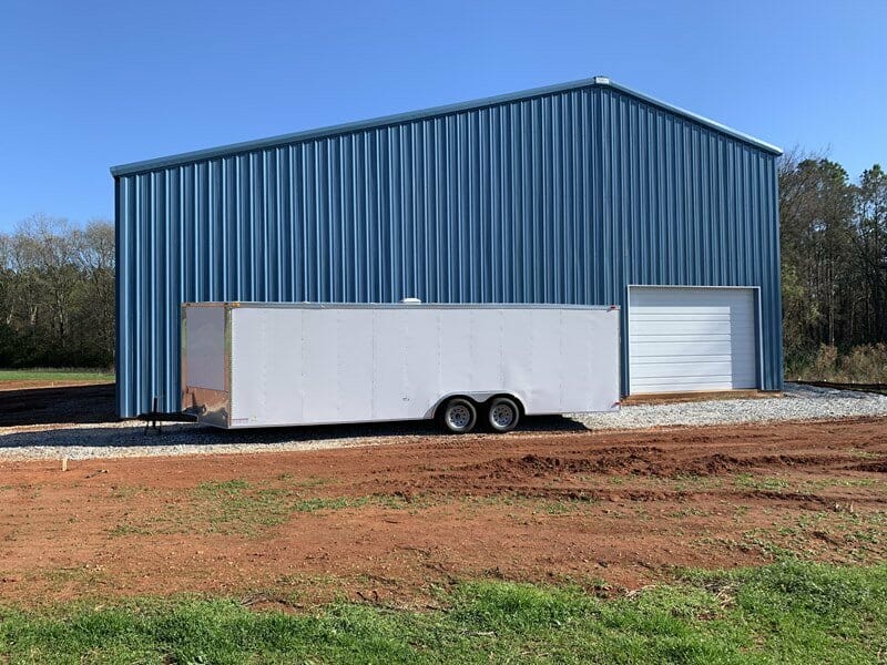 Interior View Of Pre-Engineered Metal Garage Building With Roll Up Garage Doors