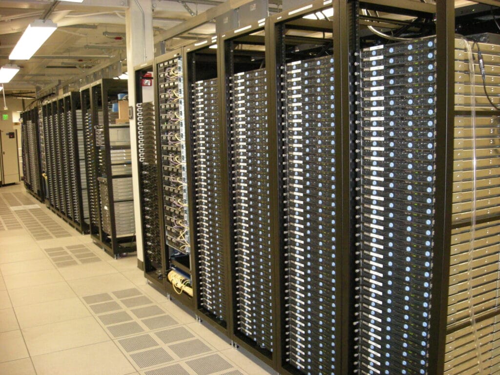 interior shot of a data center steel building with servers lined up filling the large space