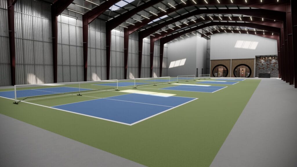 indoor pickleball court inside the warehouse building with green and blue color