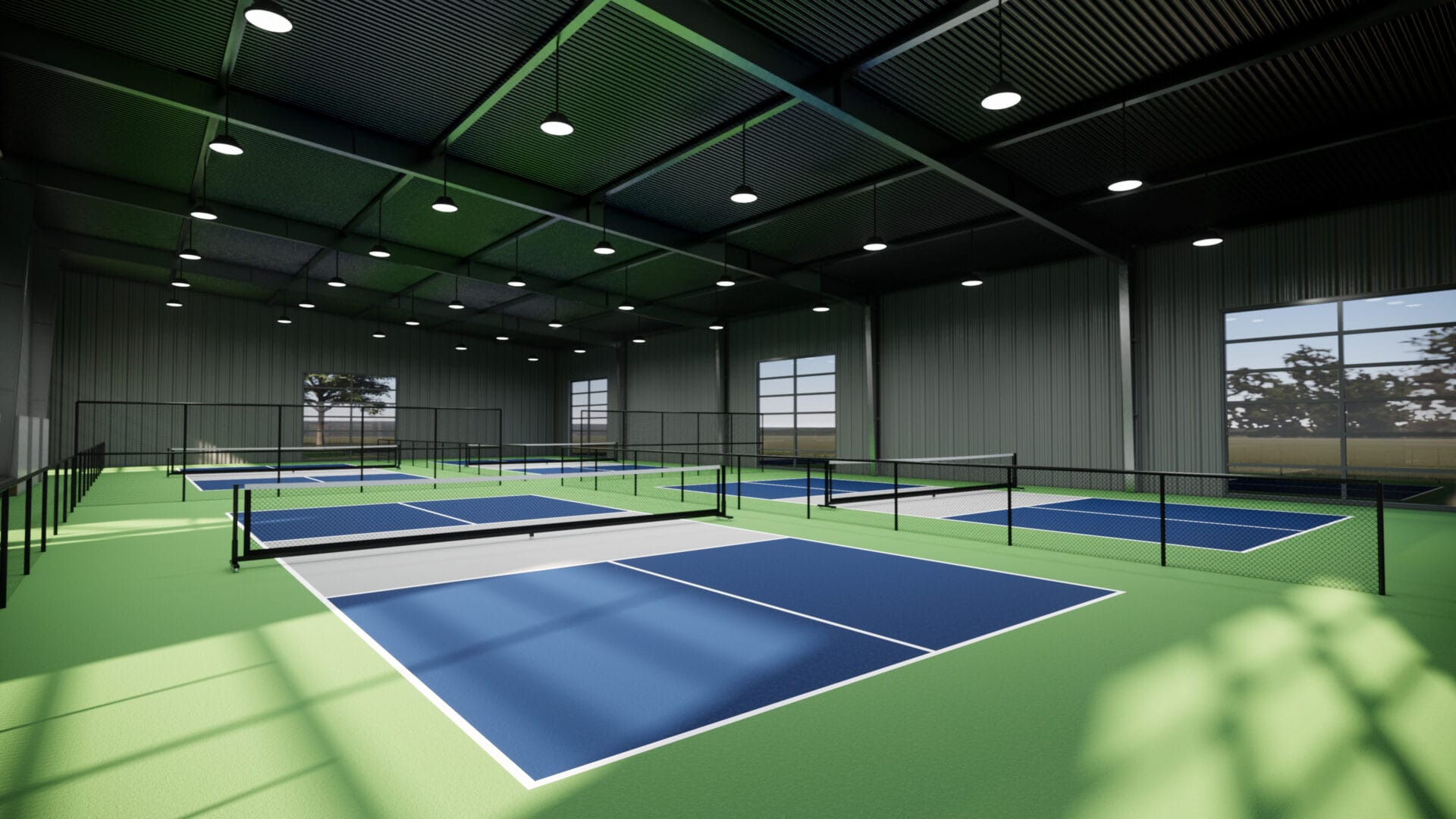 An indoor pickleball court with a blue and white surface.