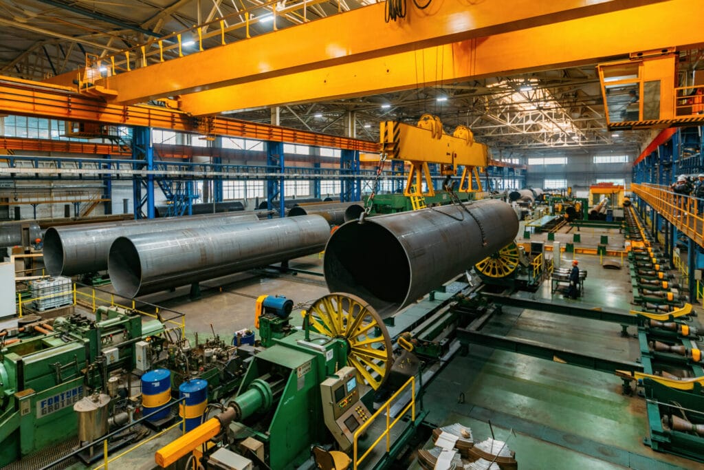 Finished pipe transportation by overhead crane in pipe factory